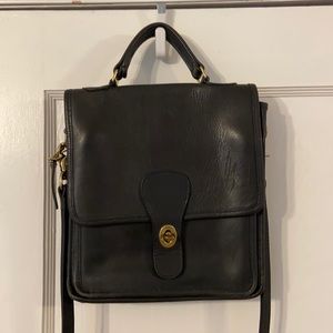 Coach cross body bag. Dark charcoal is color.